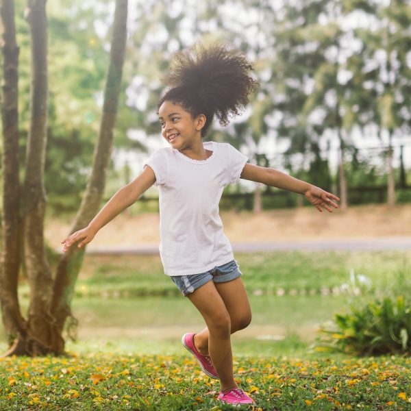 Cute african american little girl playing outdoor